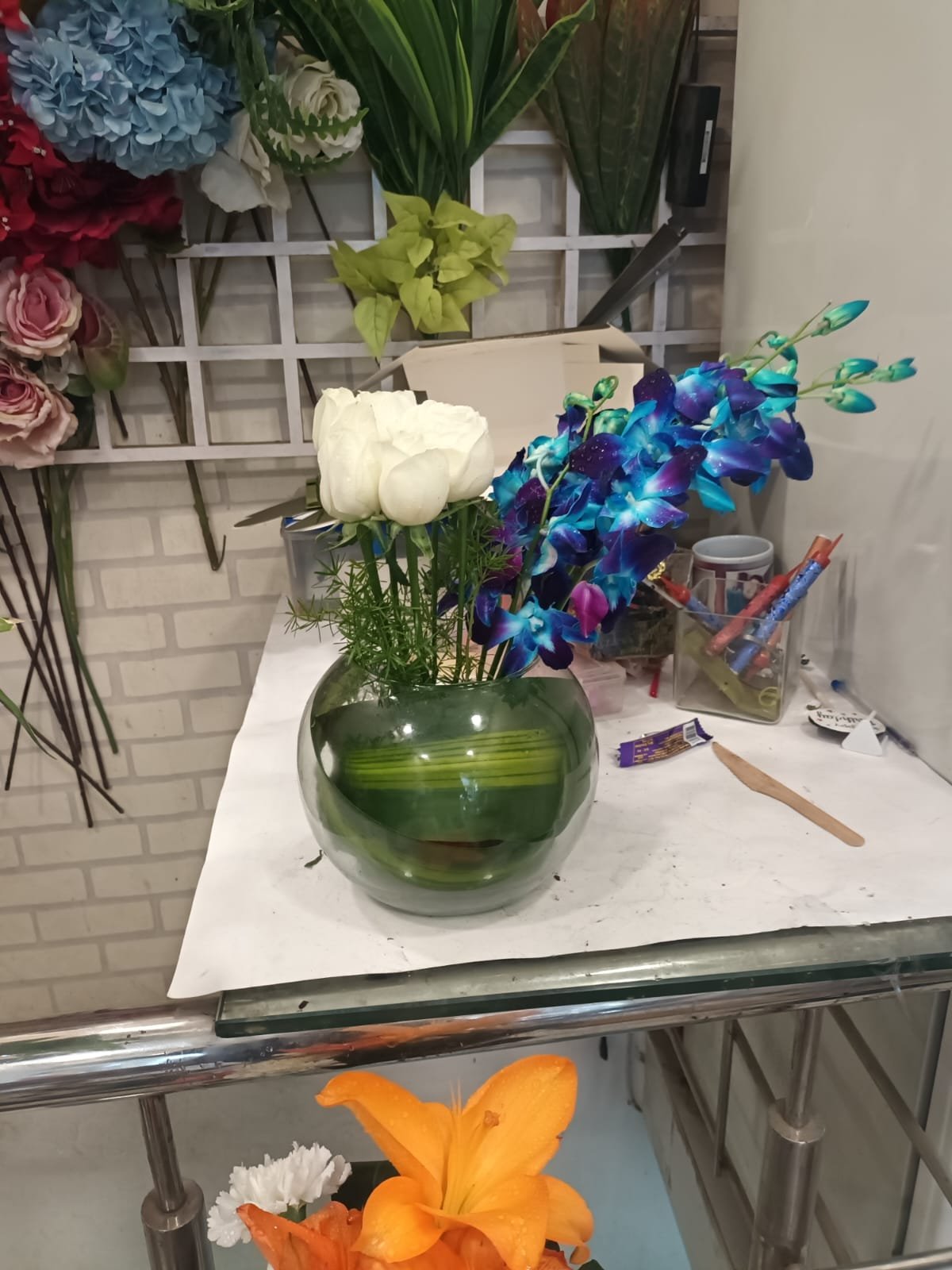 Orchids and White Roses in Fish Bowl