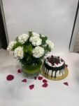 10 White Carnations in Fish Bowl with Black Forest Cake