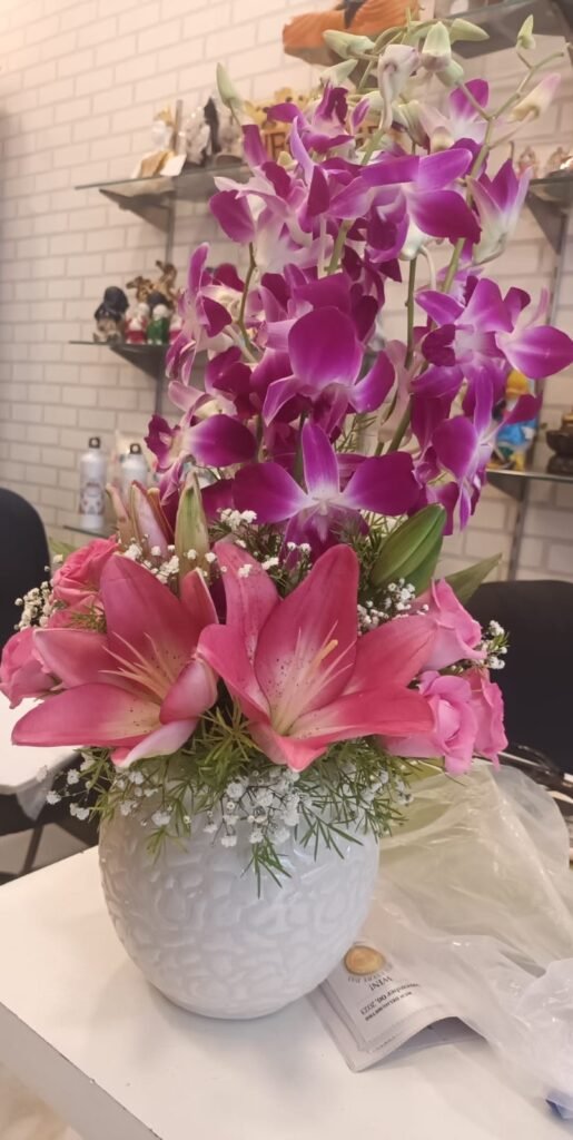 Orchids and Lilies in Vase