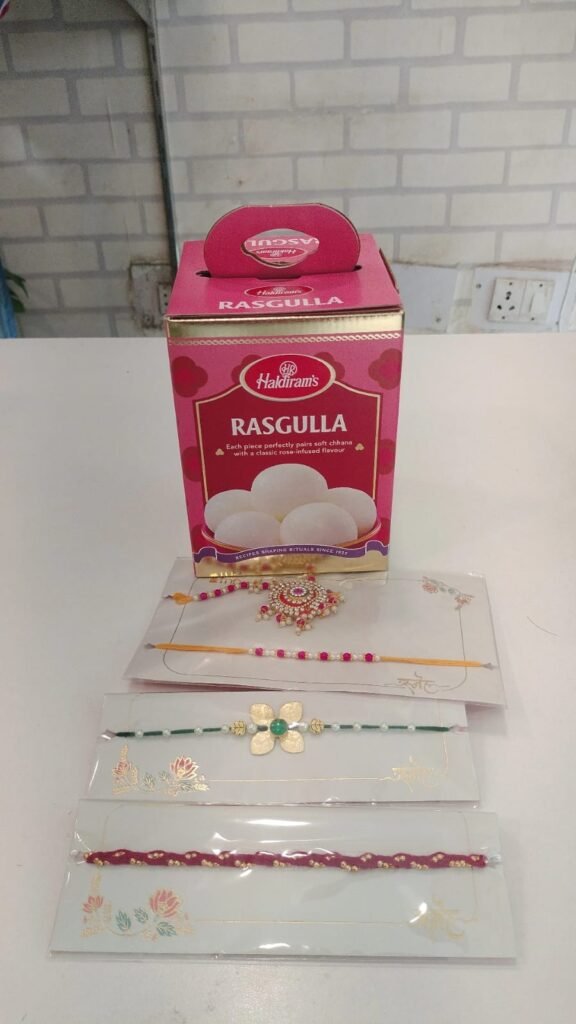 Family Rakhi and Haldiram's Rasgulla Box